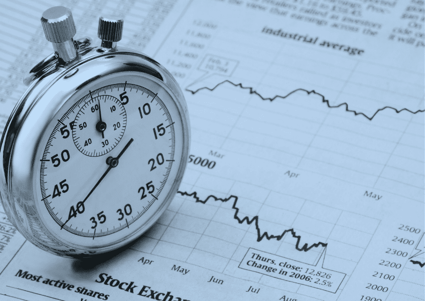 Stopwatch on top of a stock chart, representing the importance of time to market for startups