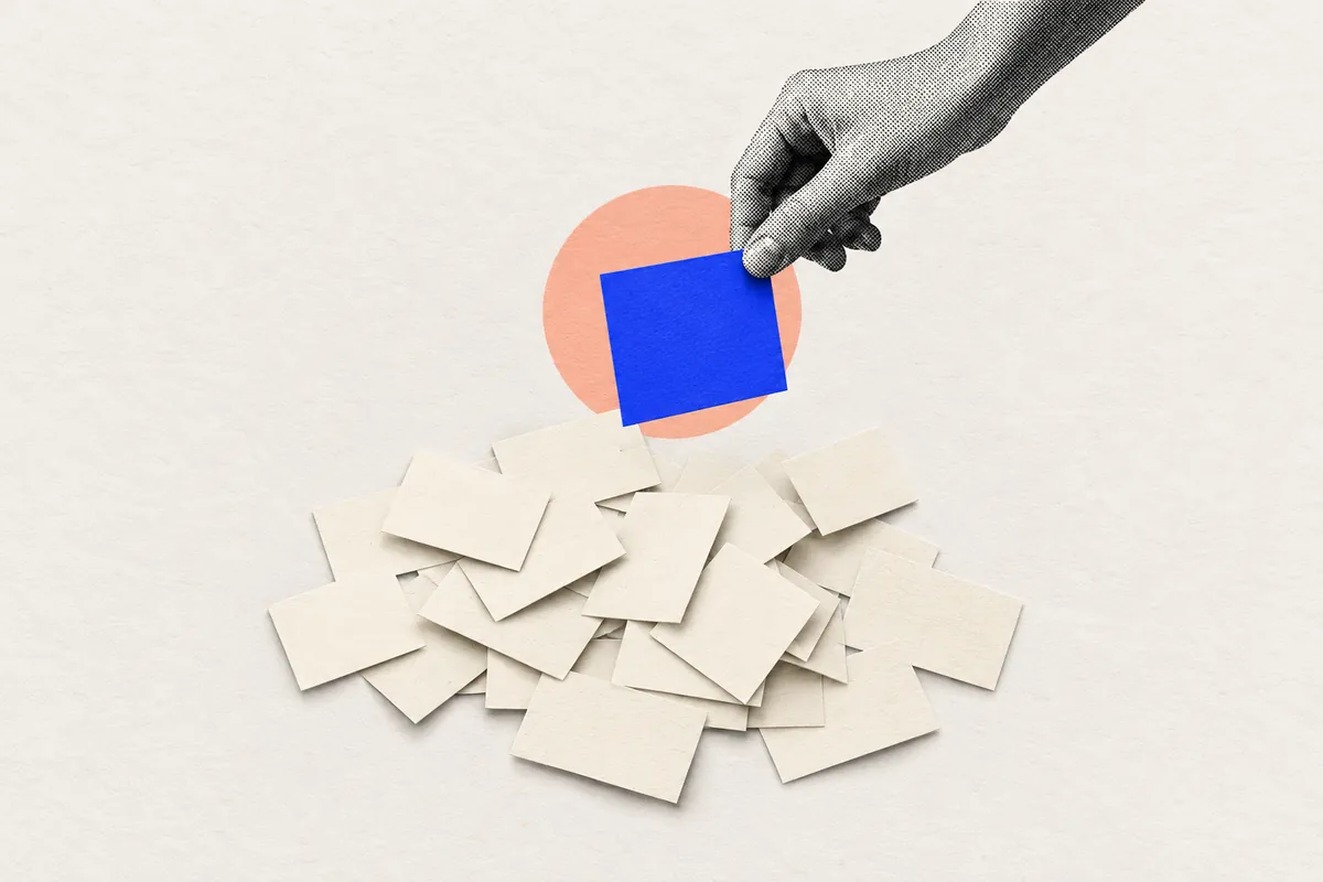 A hand pulls one blue card out of a pile of blank cards: picking the one job your app must do first